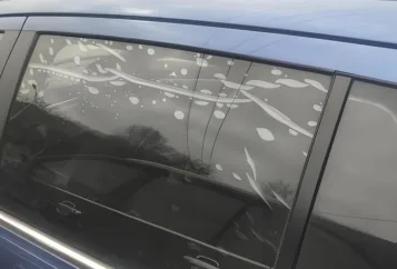 A bubbling window film on car door glass need to be removed.