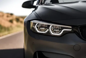 A BMW's headlight had been restored. It was like brand new.