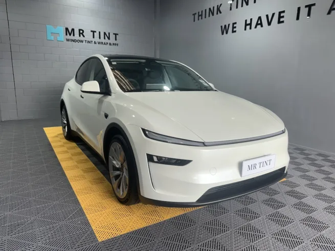 Full body paint protection film on white Tesla Model Y
