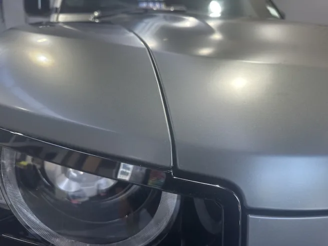 Close-up of paint proteciton film edge on Defender